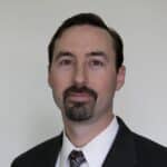 Professional male financial advisor in formal suit for Christian Financial Advisors.