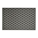 Stylish black and white geometric rug for college dorm decor.