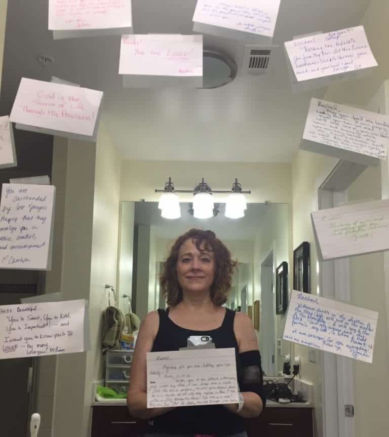 Rachael holding a handwritten note with floating notes around her in an office setting.