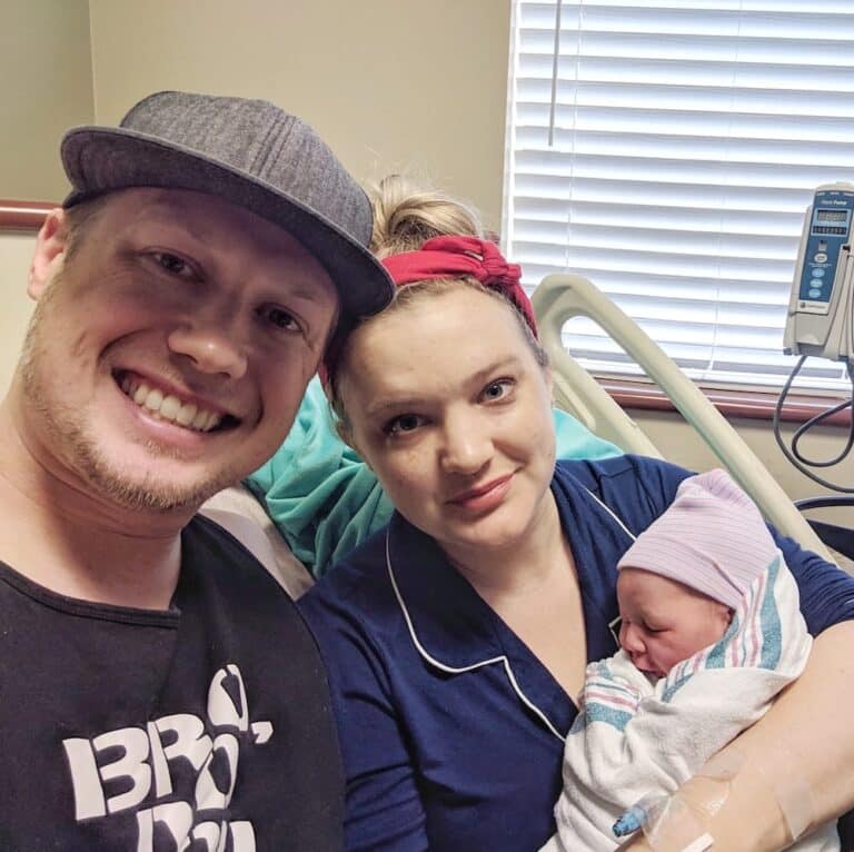 Say Hello To Rhonan 6 Family celebrating birth of a baby in hospital room with mother, father, and newborn.