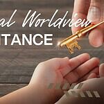 Home Default 2 Hand passing a key symbolizing inheritance over a wooden table.